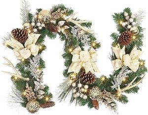 the letter o is decorated with pine cones and white flowers