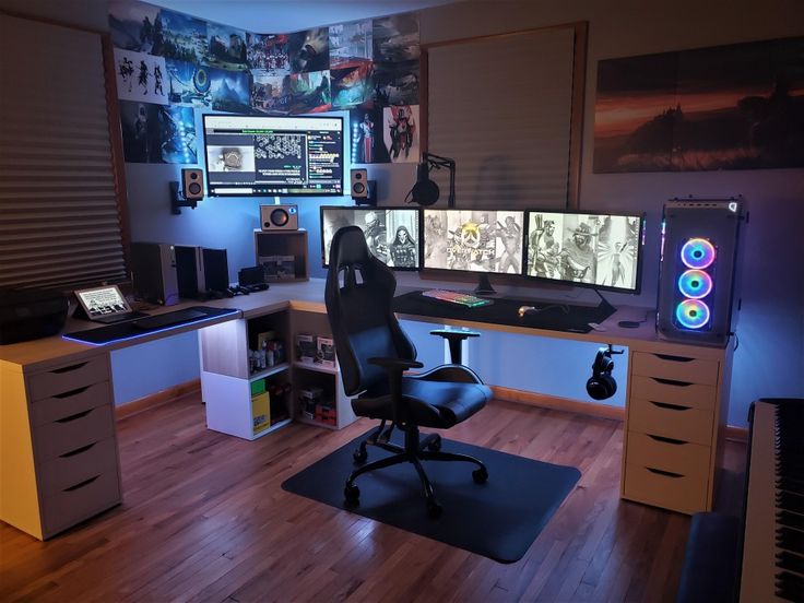 a room with several computer monitors and keyboards