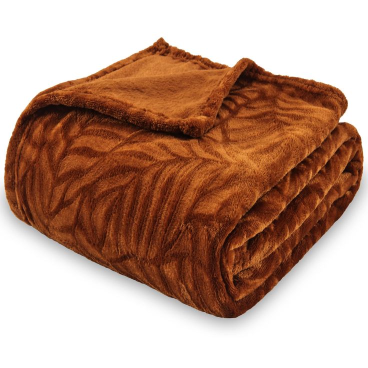 a brown blanket is folded on top of each other and it looks like they have been made out of fur