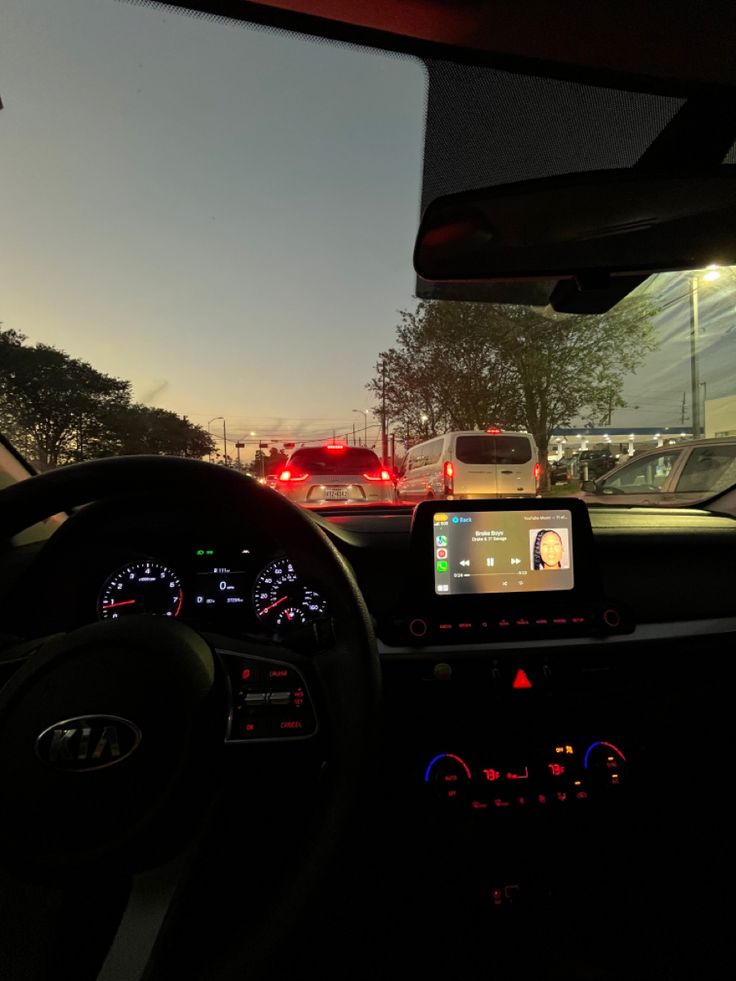 the dashboard of a car at night time