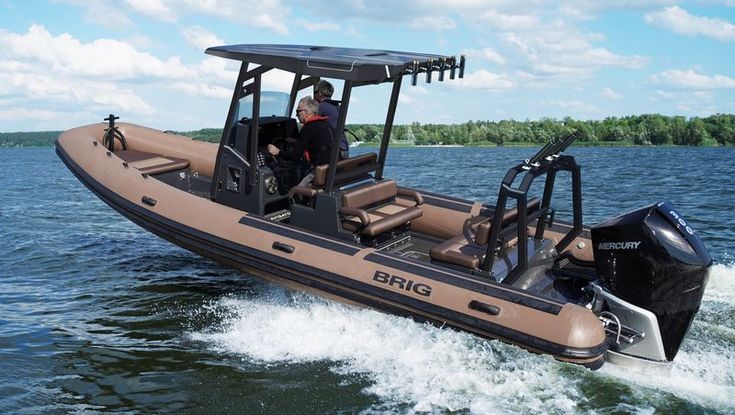 a man riding on the back of a brown boat