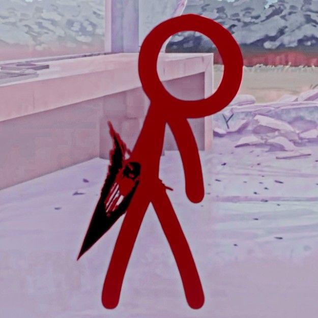 a red pair of scissors sitting on top of a snow covered ground next to a window