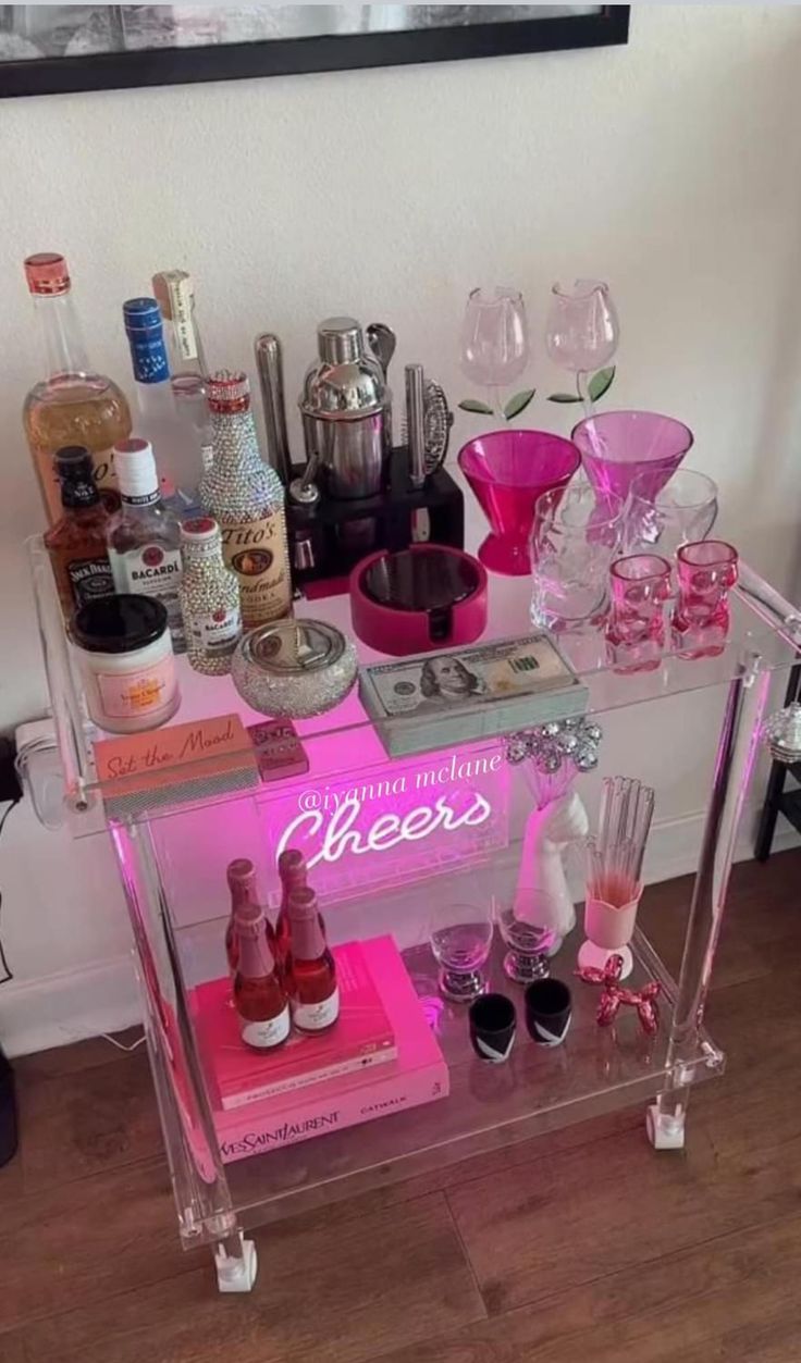 a bar cart filled with liquor bottles and glasses