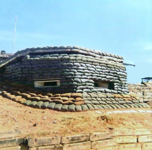 a building made out of rocks on top of a hill