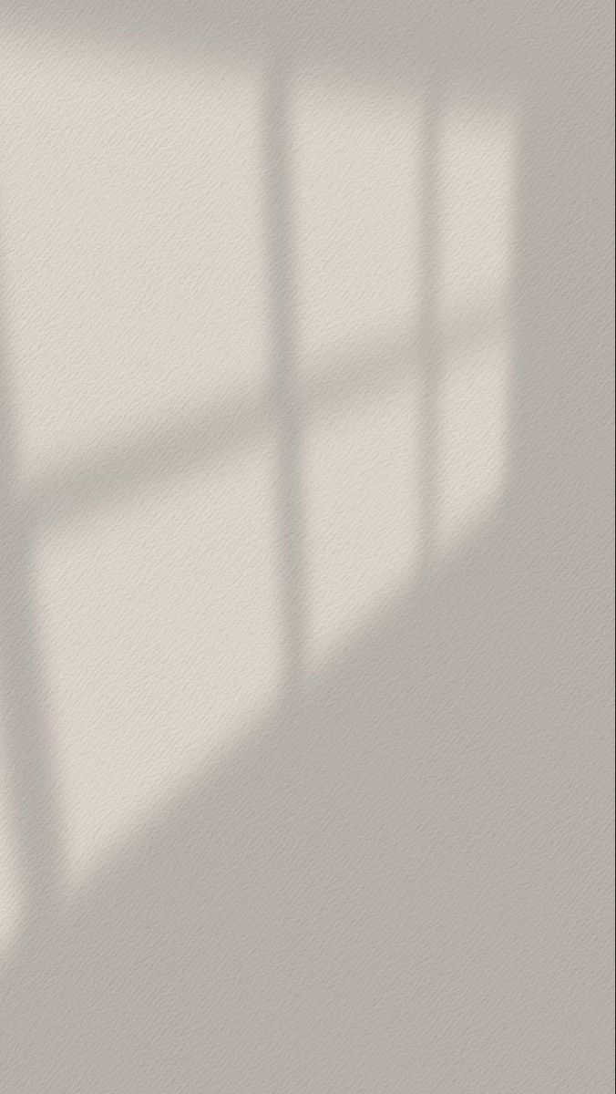 the shadow of a window on a wall