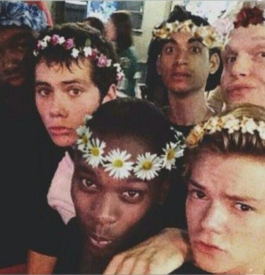 a group of people with flower crowns on their heads