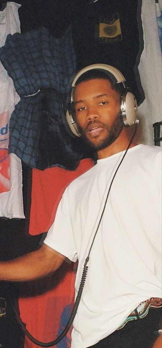 a man wearing headphones and listening to music