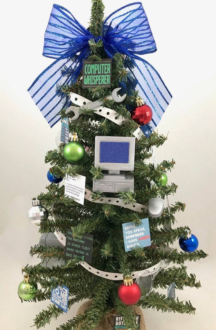 a computer christmas tree with blue ribbon and ornaments on it's top, in front of a white background