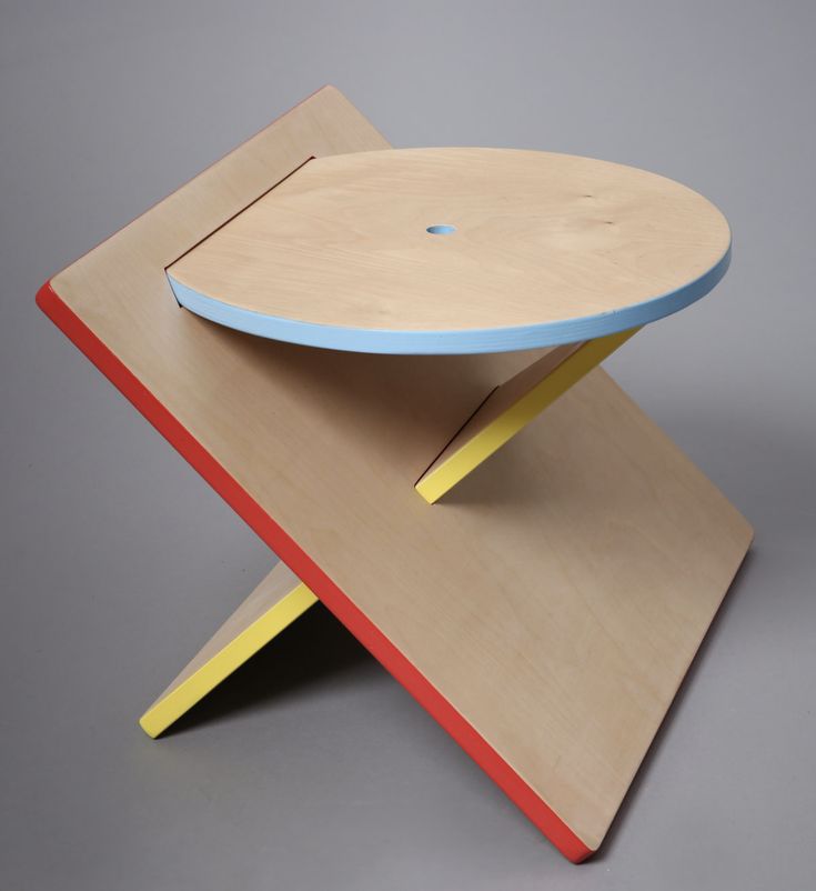 a wooden table with a blue and yellow top