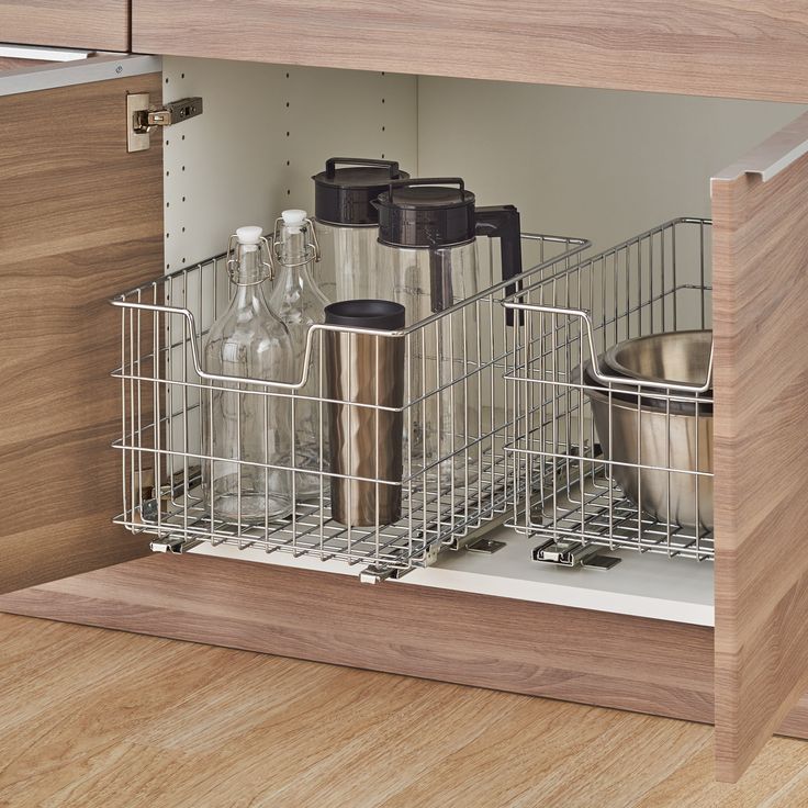 an open dishwasher drawer in a kitchen