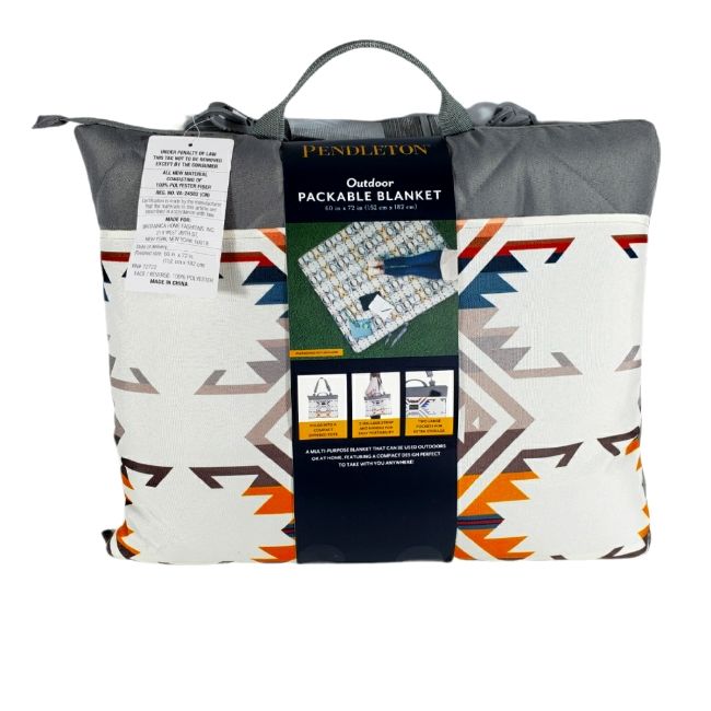 the pendleton blanket is shown in white and grey with an orange, blue, and gray design