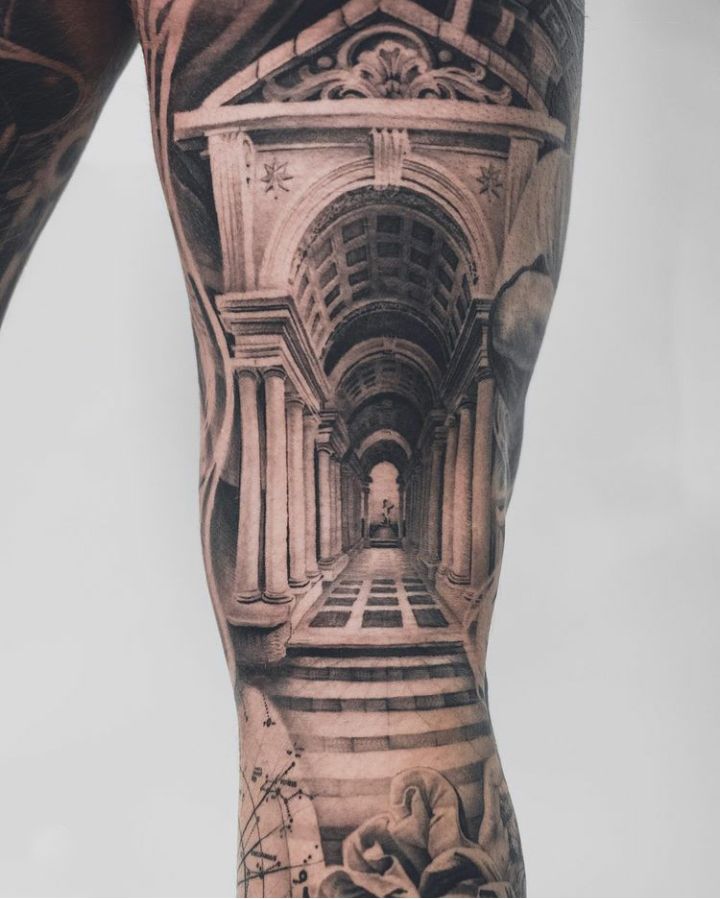 the back of a man's leg with an image of a building on it