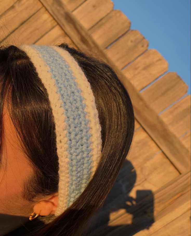 a close up of a woman wearing a headband