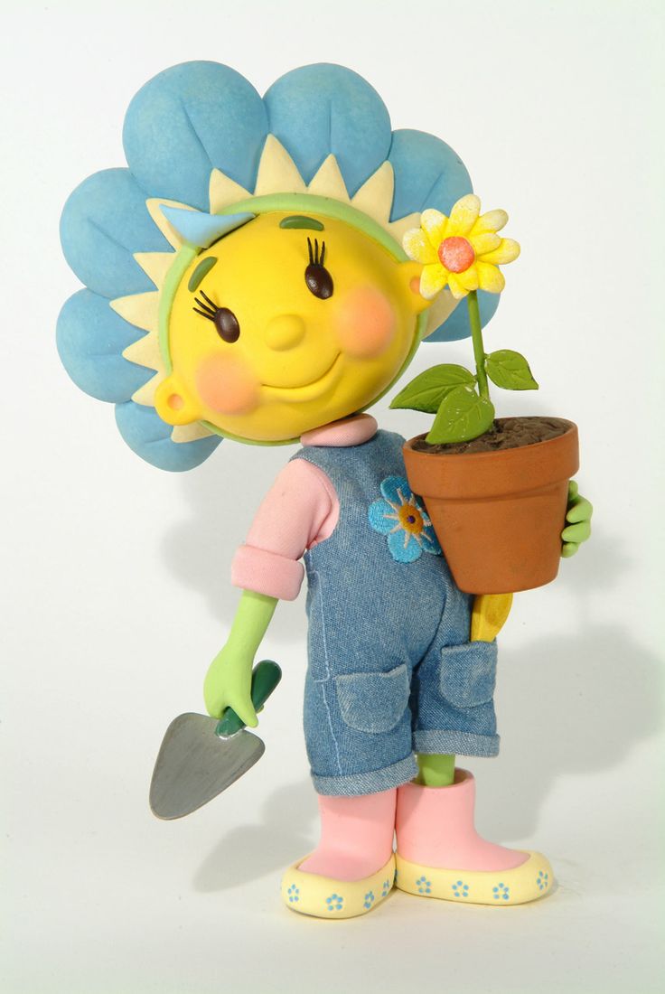 a toy doll holding a potted plant with a flower on it's head