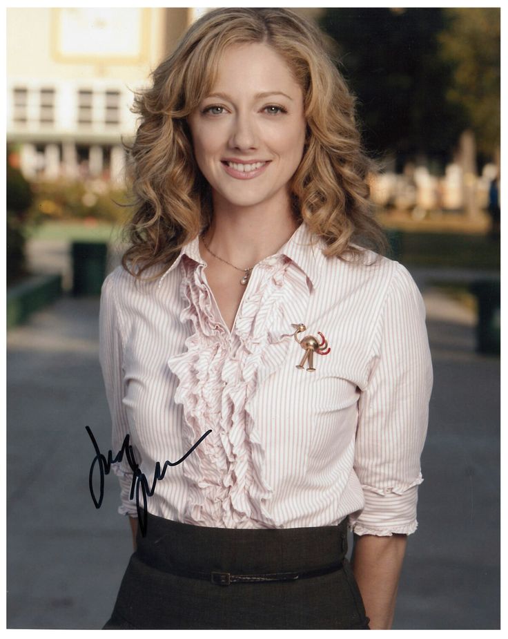 a woman in a pink shirt and black skirt