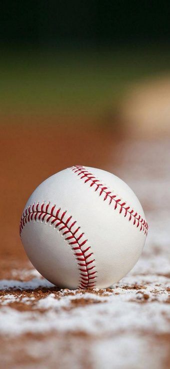 a baseball sitting on top of a baseball field