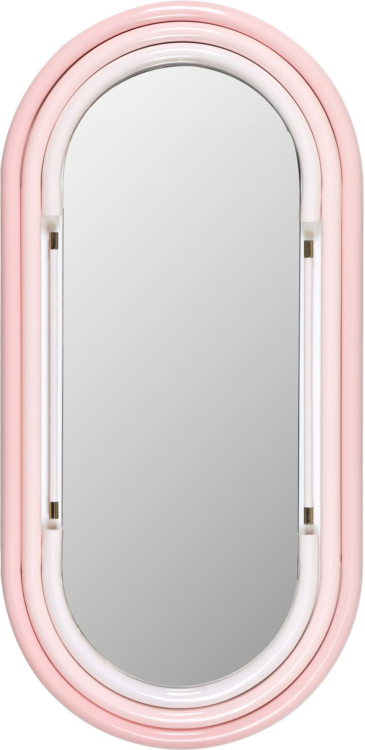 a pink mirror sitting on top of a white wall