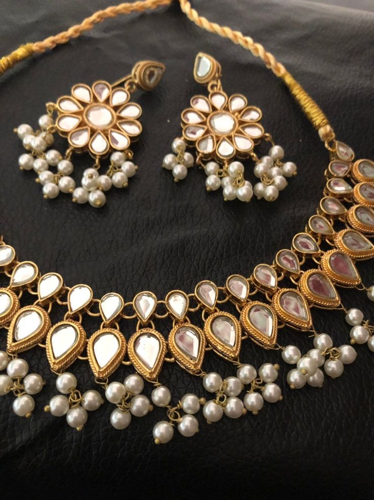 High quality kundan necklace and earrings dipped in 22 karat gold Made to order and shipping time 4 to 6 weeks. Kundan Jewelry With Mirror Work For Gift, Gold Plated Meenakari Bollywood Necklace, Gold Plated Kundan Necklace For Festivals, Round Gold Plated Kundan Necklace For Festivals, Gold Plated Meenakari Necklaces Bollywood Style, Gold Meenakari Kundan Jewelry Sets, Gold-plated Kundan Necklace For Festivals, Gold Plated Bollywood Style Necklace, Gold Plated Heavy Bollywood Necklace