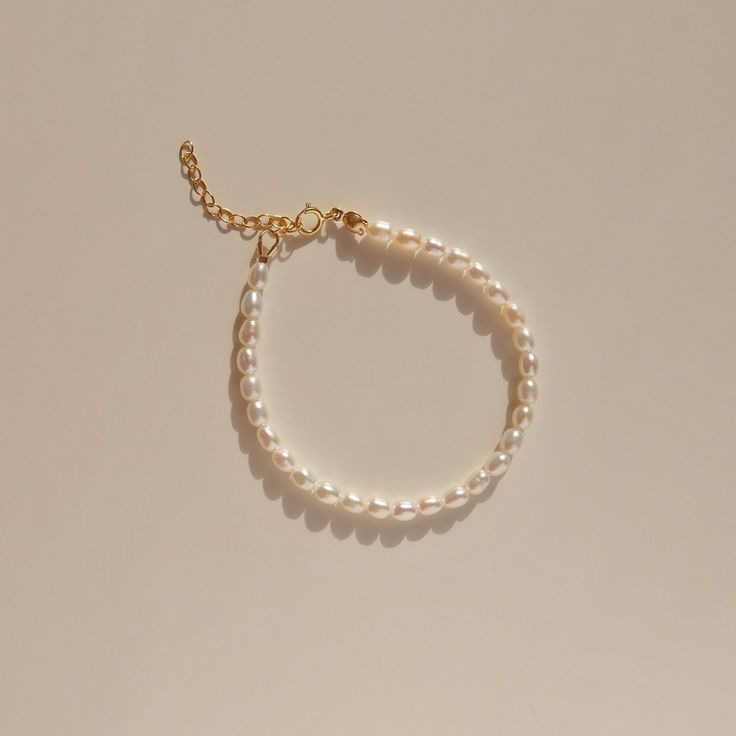 A classic pearl piece that will never go out of style. Handmade with freshwater rice pearls and 14k gold filled findings. She's the matching bracelet for the Vivian Pearl Choker. Wear it with Alida Pearl Ring, they are the perfect match! Details 3.5mm freshwater rice pearls.  14k gold filled. Extender chain of 3.5cm is available as an add-on. Wanna browse more of my bracelet series? https://www.etsy.com/ca/shop/PrettyPearlfect?section_id=31793519 Take a look at my shop to discover more pieces th Classic Everyday Beaded Pearl Bracelet, Etsy Finds Products, Pearl Beaded Bracelet, Pearl Bracelet Gold, Rice Pearls, Freshwater Pearl Jewelry, Freshwater Pearl Ring, Pearl Bracelets, Etsy Bridesmaid Gifts