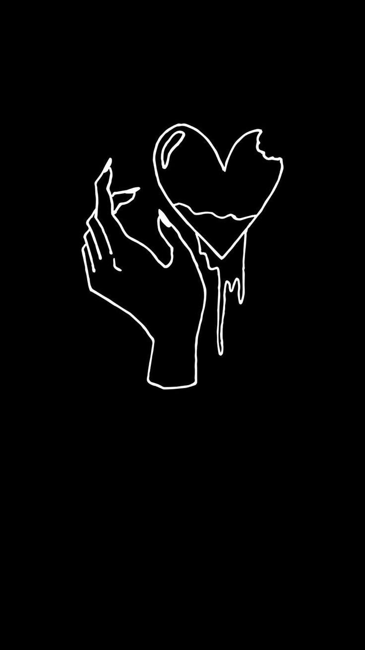 two hands holding a heart with dripping paint on it in the middle of a black background