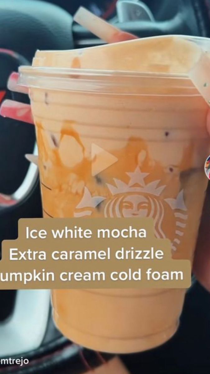 someone is holding up a cup with ice cream in it and the caption reads, ice white mocha extra caramel drizzle pumpkin cream cold foam