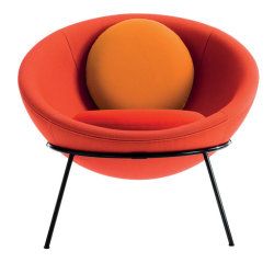 an orange chair with black legs and a yellow ball on the backrest, in front of a white background