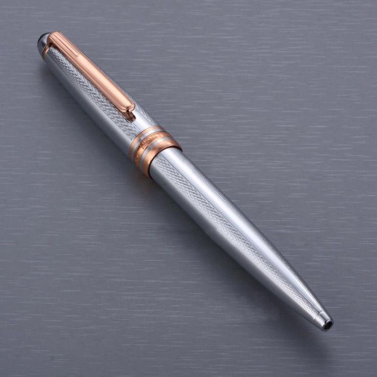 a silver pen with a rose gold trim on it