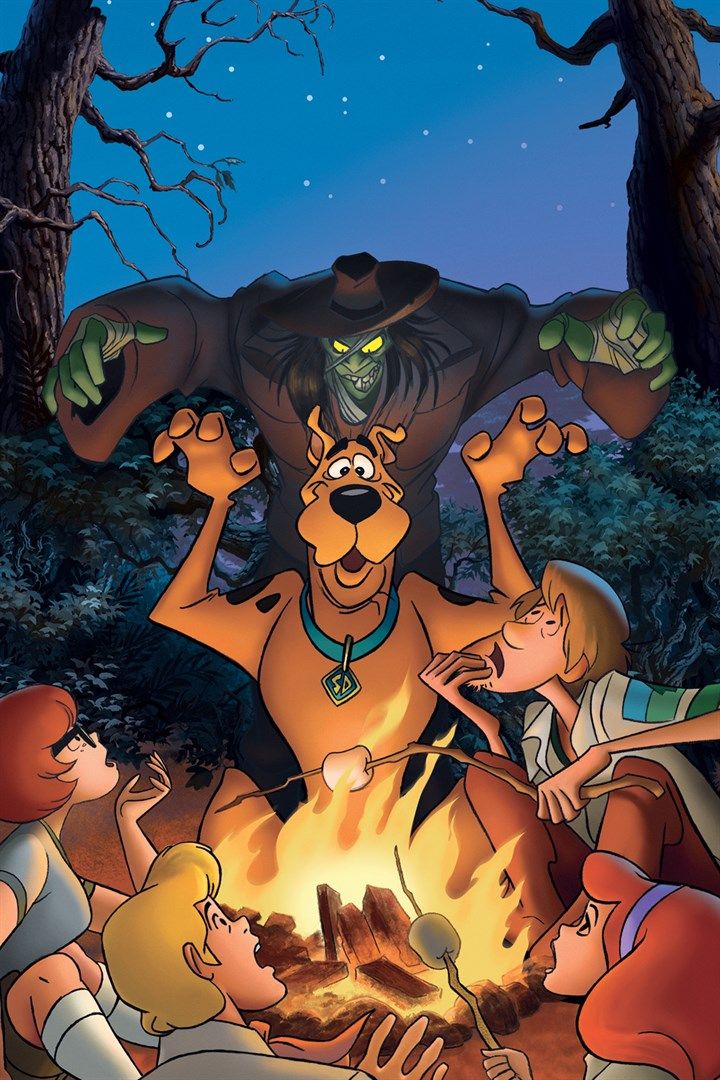 the scooby gang is around a campfire