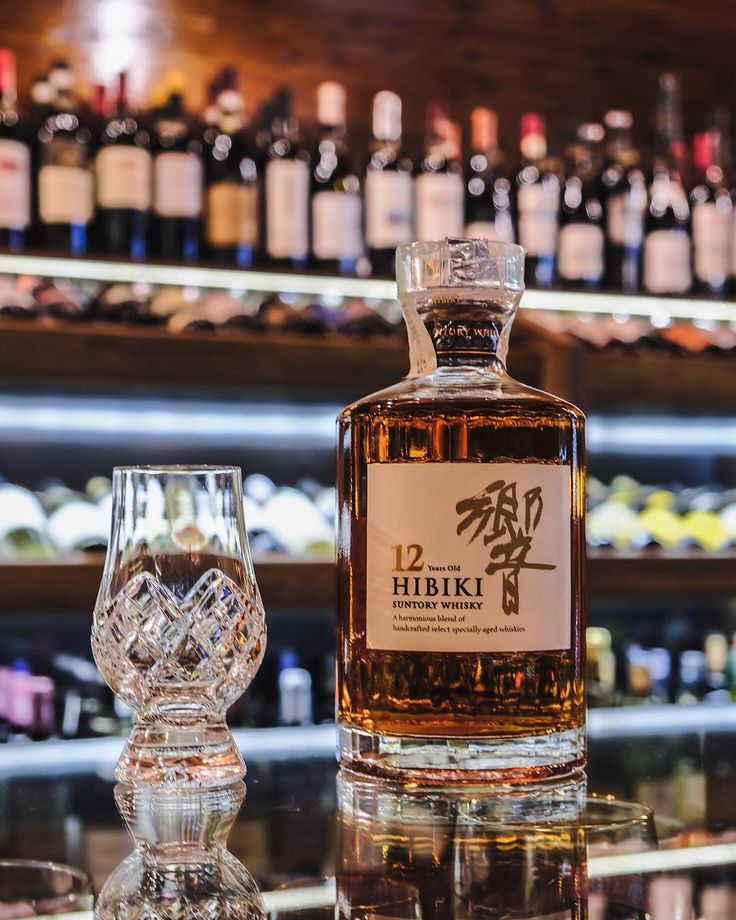 a bottle of whisky sitting on top of a table