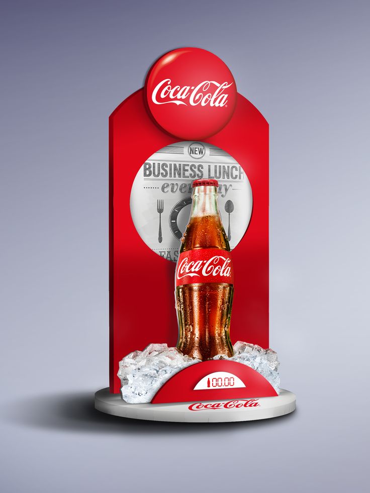 a coca - cola machine with ice on the bottom