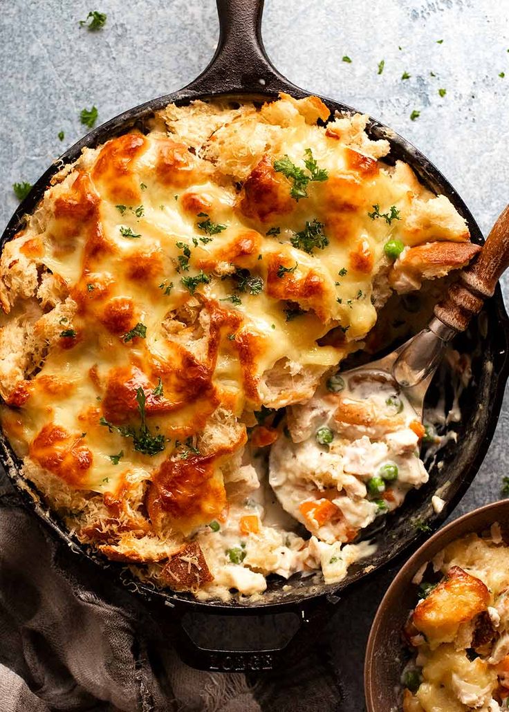 a cast iron skillet filled with chicken and cheese casserole