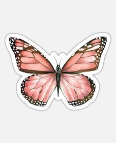 a pink butterfly sticker sitting on top of a white surface with the wings open