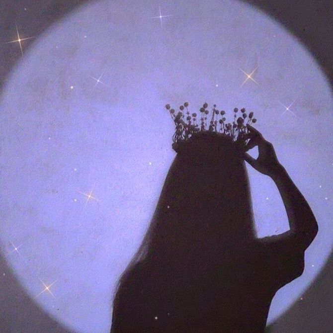 the silhouette of a woman with a crown on her head