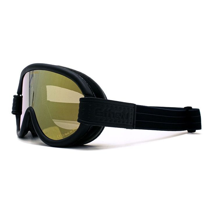 a pair of ski goggles with yellow lens on top of the glasses is black