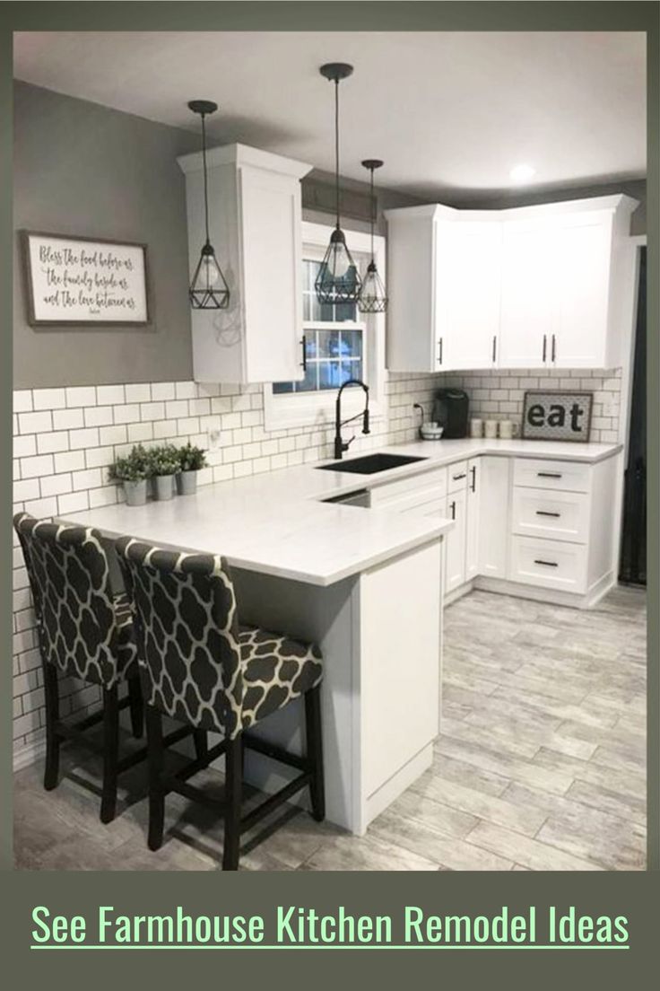 a kitchen with white cabinets and gray tile flooring