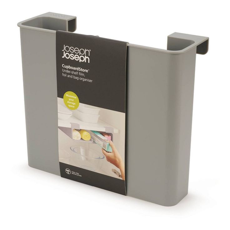 a magazine holder with two magazines on it's sides and one in the middle