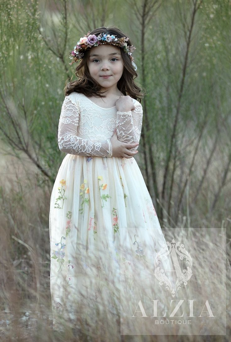 This stunning lace gown will have all eyes on her! Features the lace V-back with lovely scalloped edges and soft flowy floral embroidered tulle skirt. The fabric showcases delicate embroidered flowers, along with the heartfelt words, "forget me not" and other botanical names like: "violet", "camomile", "bindweed", "chestnut"  butterfly, etc... Sorry "no wording" is not an option and can't be excluded.  The lace used in the bodice is very soft and lined at the front with a stretch jersey cotton, making it comfortable against the skin. This dress is perfect for all occasions, family portraits, junior bridesmaids or flower girls, birthday parties and more. Pull-on styling; fully lined!  ACCESSORIES ARE NOT INCLUDED  SIZE & FIT : True to size, the lace is stretchy and looks best when it's not Summer Floral Dress, Tulle Flower Girl Dress, Girls Dress Shop, Girls Easter Dresses, Tulle Flower Girl, Tulle Flowers, Timeless Dress, Flower Girl Dresses Tulle, Embroidered Tulle