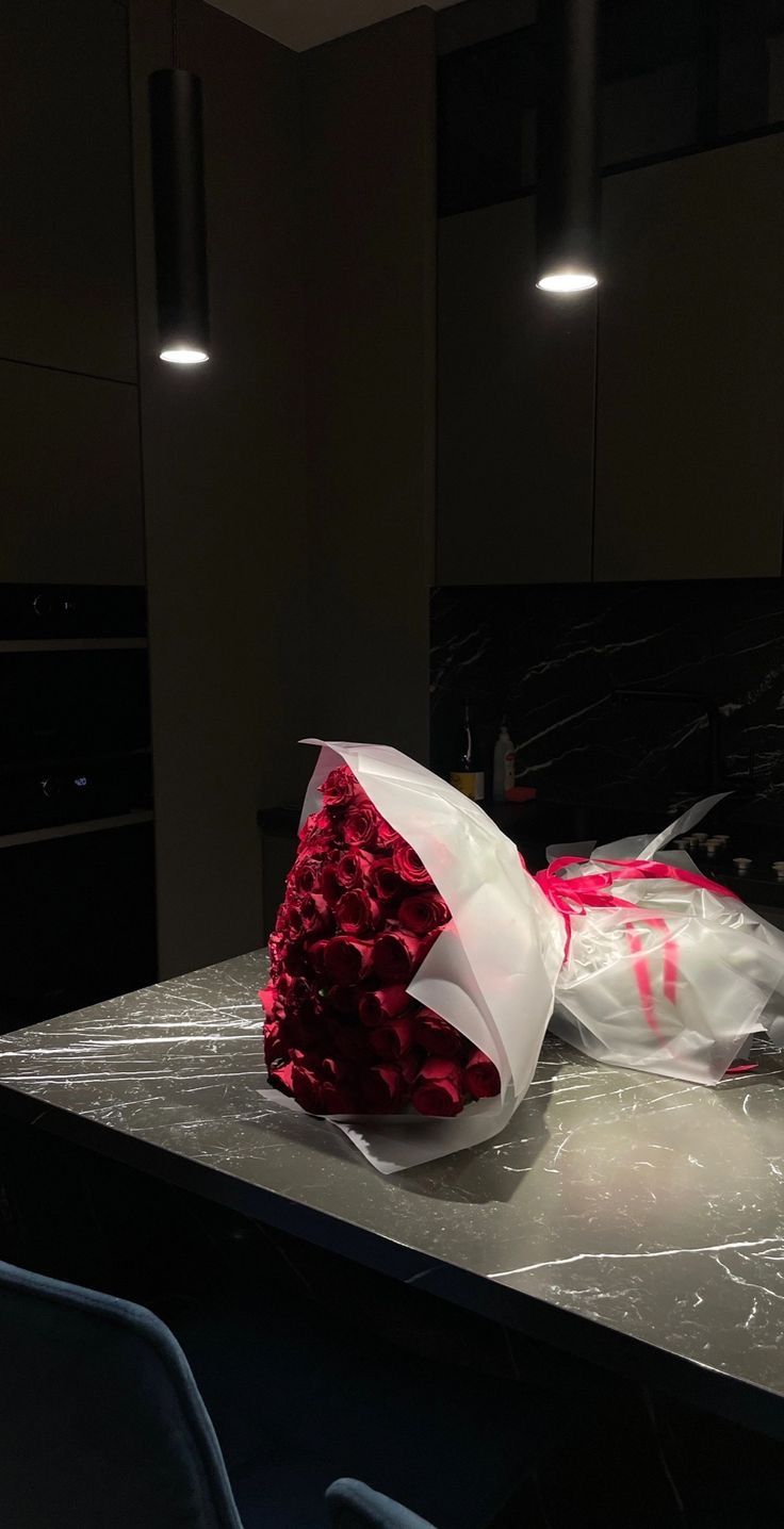 a bouquet of flowers sitting on top of a counter