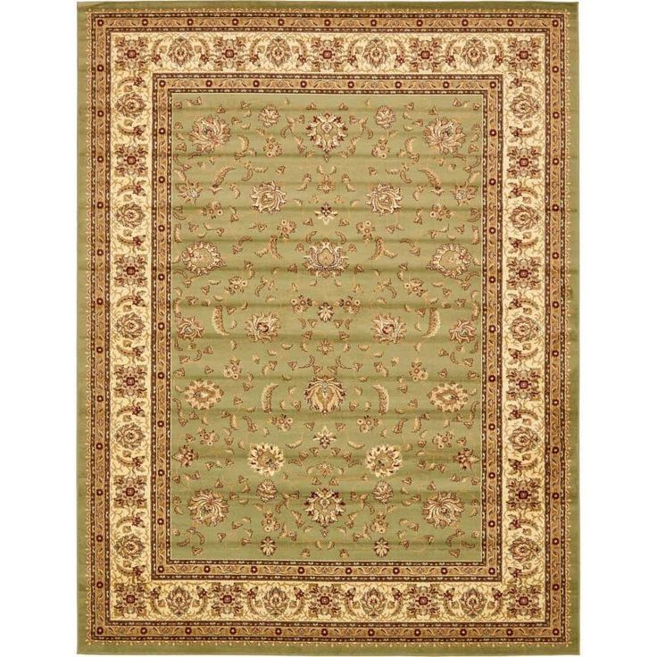 a green rug with gold trimmings and an ornate design on the bottom corner