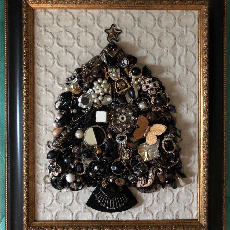 This Vintage Jewelry Mosaic Is Made Of 45+ Recycled Earrings, Brooches, Pendants And More In All Pieces Black & White. 1/2 Of The Pieces Are Amazing 4” Earrings From The 80s Made Of Plastic With Large Baubles & Dangles. The Rest Are Vintage Cluster Earrings, Pearl Drops, Cameos, Shoe Clips And Dress Clips. Each Piece Was Thoughtfully Arranged On Top A Textured Geometric Patterned Fabric And Then Framed With A Recycled Frame! Saving The Planet One Brooch At A Time. Jewelry Mosaic, Jewelry Trees, 4 Earrings, Recycled Earrings, Saving The Planet, Dress Clips, Vintage Jewelry Art, Dress Clip, Jewelry Tree