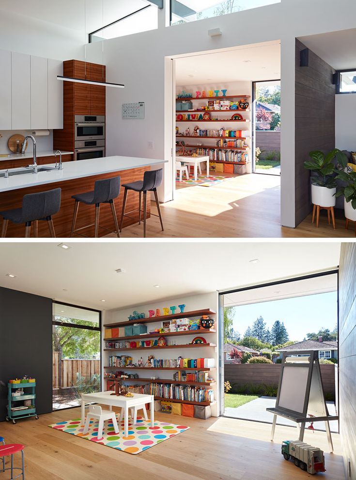 this kitchen is open to the outside and has lots of shelves on both sides of the room