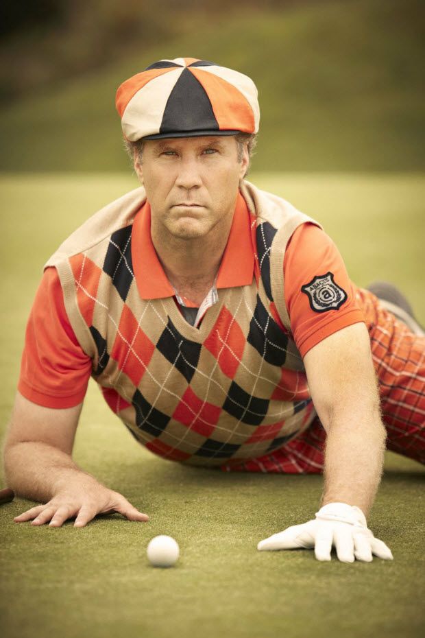 a man laying on the ground next to a golf ball