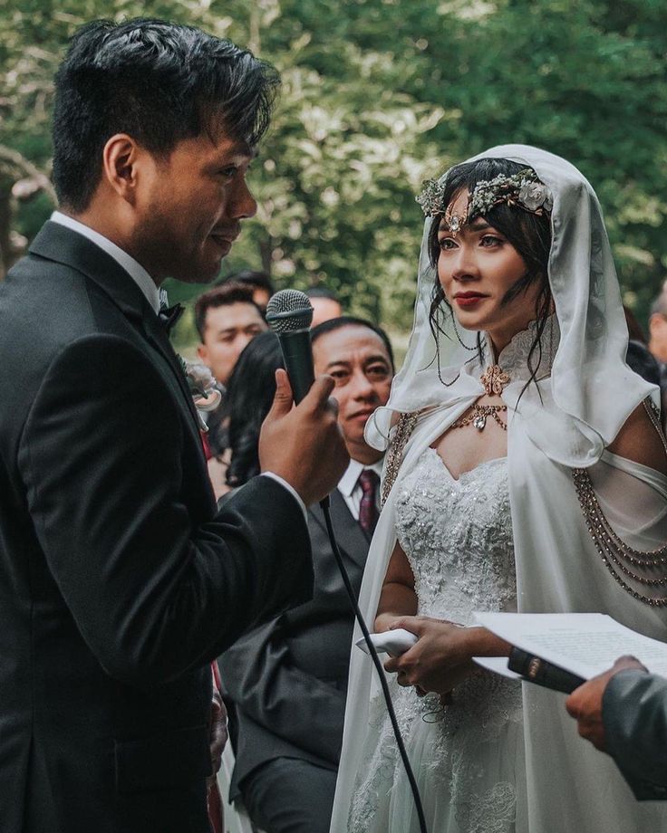 a bride and groom are exchanging vows at their wedding