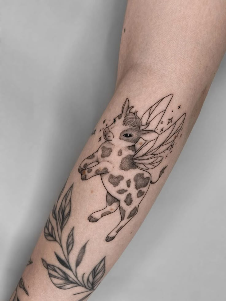 a woman's arm with a horse tattoo on it