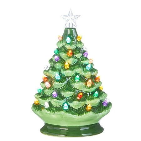 a green glass christmas tree with lights on it