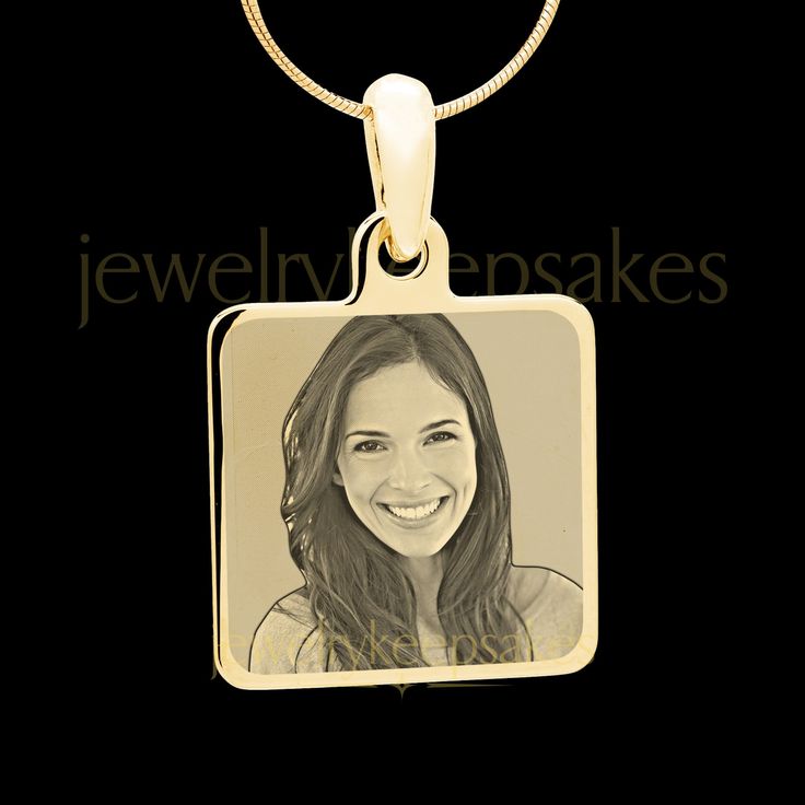 a gold pendant with a woman's face on it