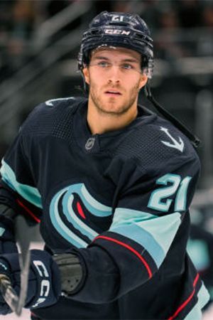 a hockey player in uniform on the ice