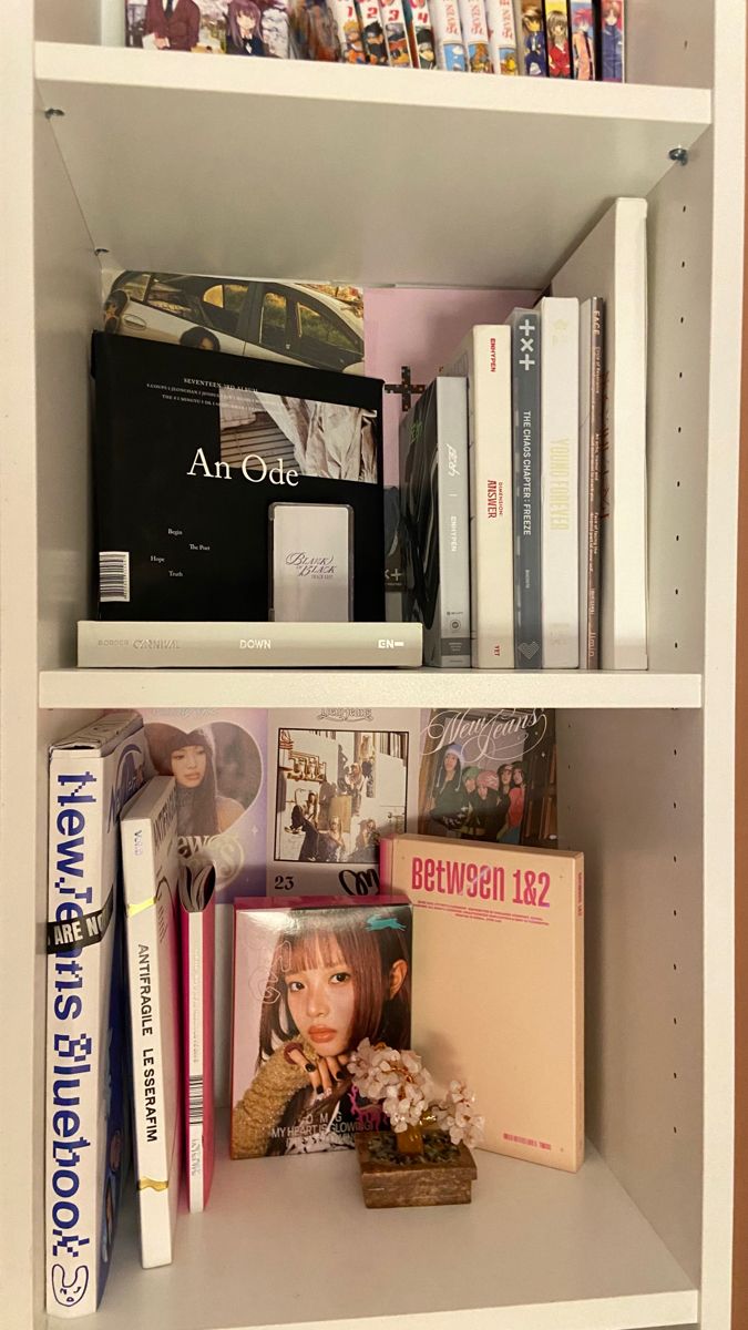 a book shelf filled with books and magazines