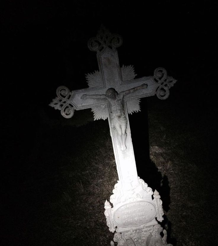 the cross is lit up in the dark