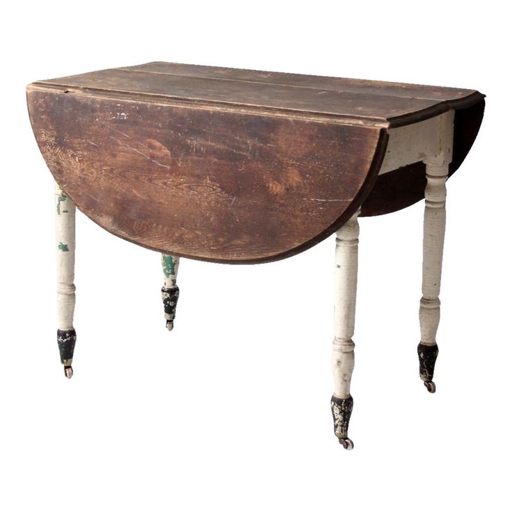 an old wooden table with two legs on one side and a small drawer on the other